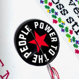 Power To The People Needle Minder